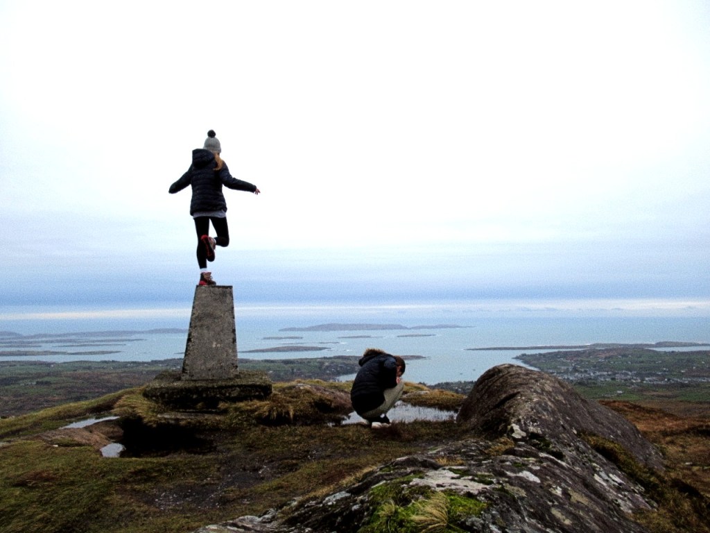 child balancing on trig beacon at mount gabriel