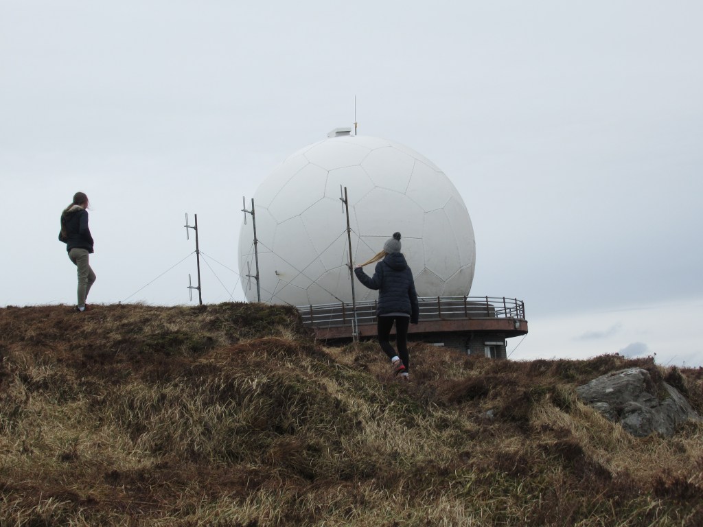 Children looking at the radar dome on mount gabriel near schull